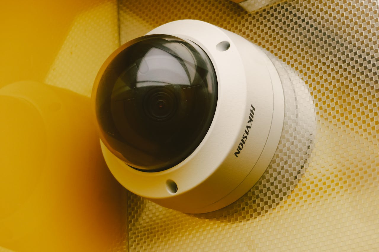 Home 2 Close-up of a modern security camera installed indoors, ideal for surveillance.